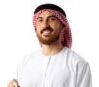 Young Arab man in traditional clothes holding beads isolated on white background